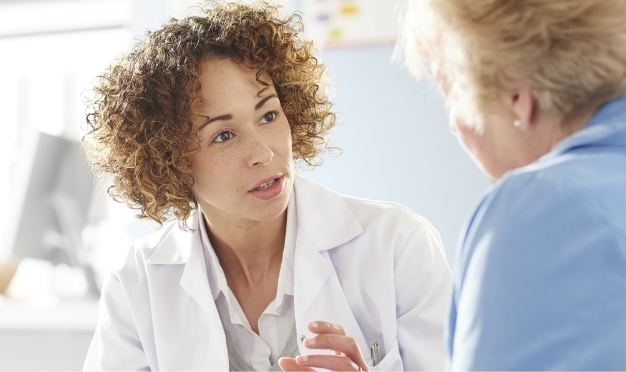 Female doctor talking to patient.