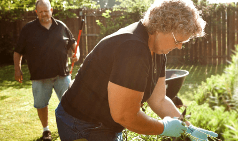 Mitch and Senita doing yard work.