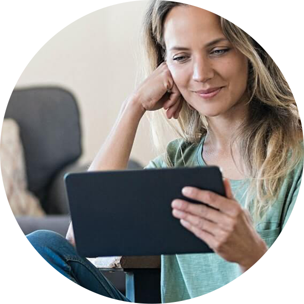 Woman watching webinar on tablet.