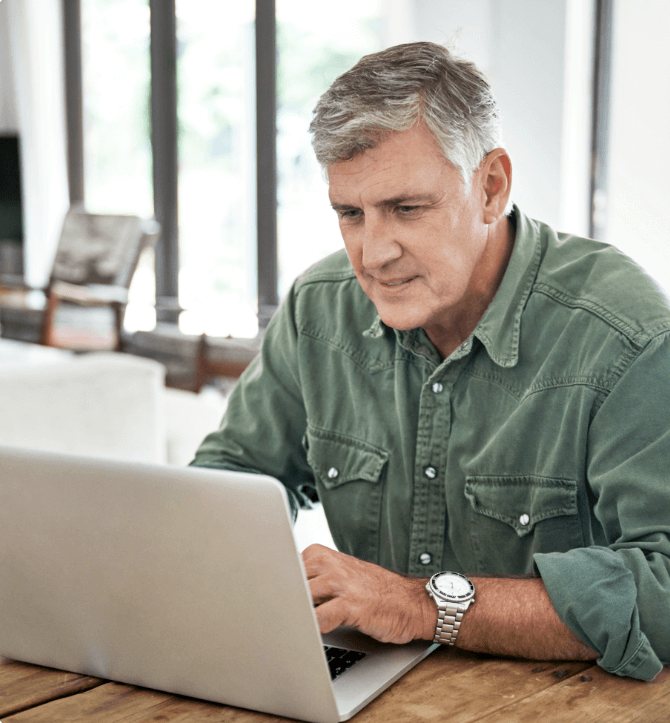 A man working on a laptop.