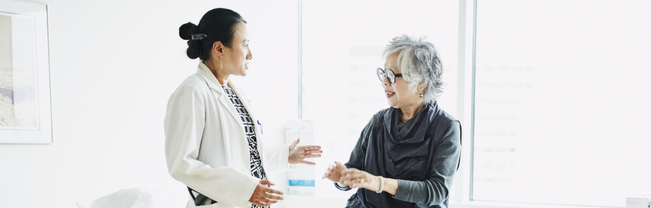 Woman physician and mature woman patient in consultation.