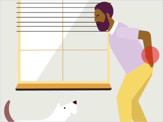 Person holding lower back in pain.