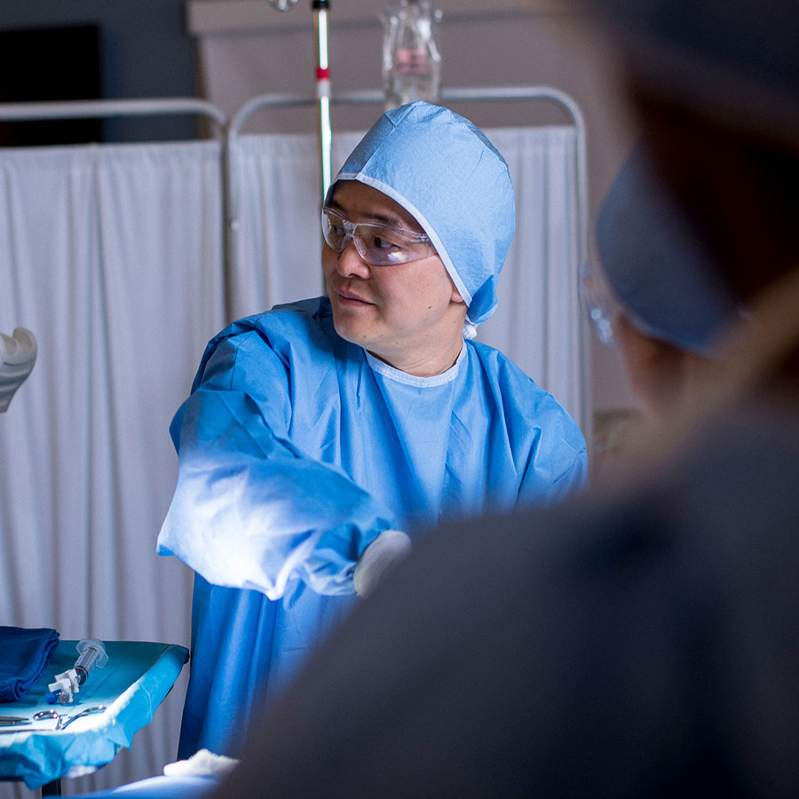 A healthcare professional focuses while in an operating room.